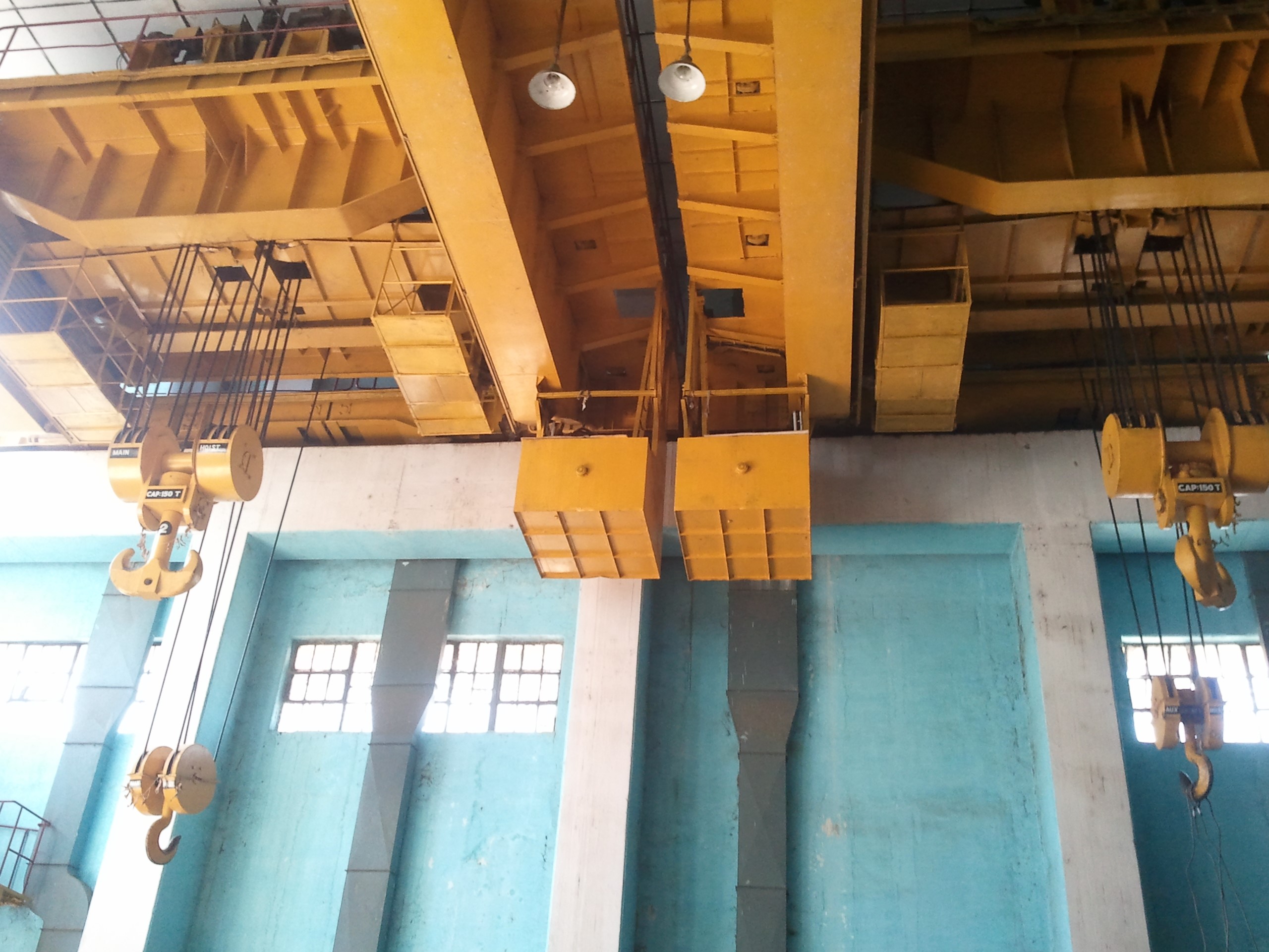 Complete Overhauling and repairing of 150/30 Tons EOT Cranes 02 Nos., including supply/ replacement required spares at Hydro Power Station, Uka
